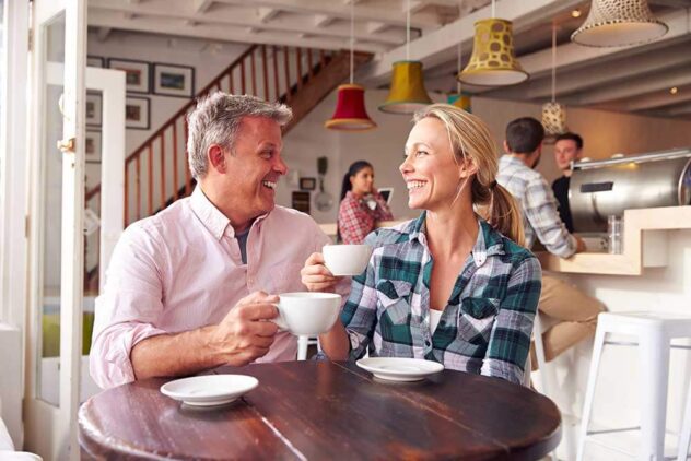 man and woman enjoying tea